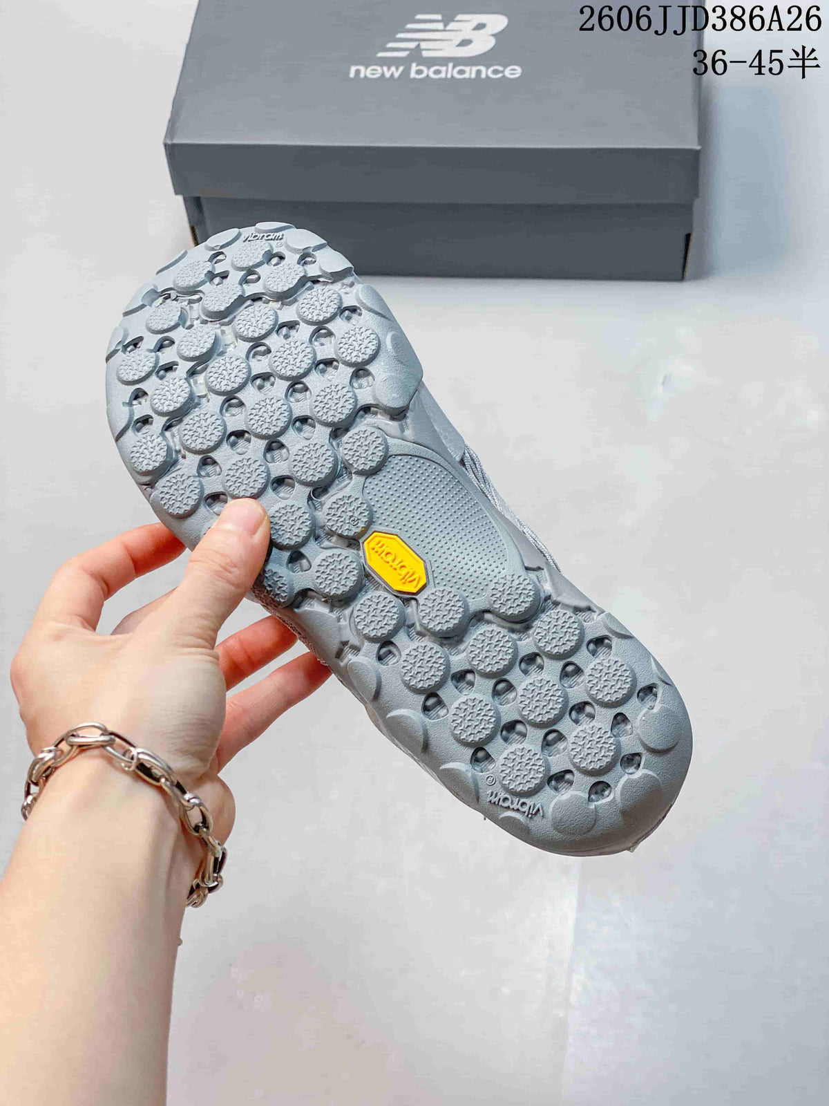 Close view of the textured outsole with a visible Vibram mark and circular tread pattern.