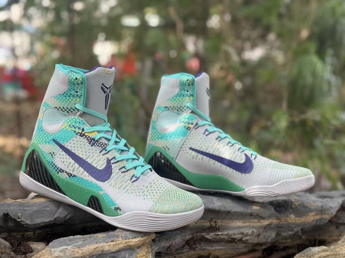 Pair of gray and turquoise high-top basketball shoes with purple details