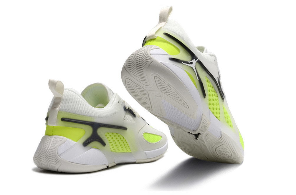 Rear and outsole views of white and fluorescent lime Jordan Heir shoes
