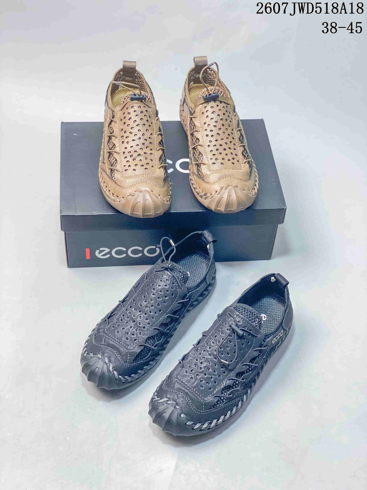 Tan and dark gray ECCO sneakers arranged around an ECCO shoe box, showing the two pictured colorways and overall design.
