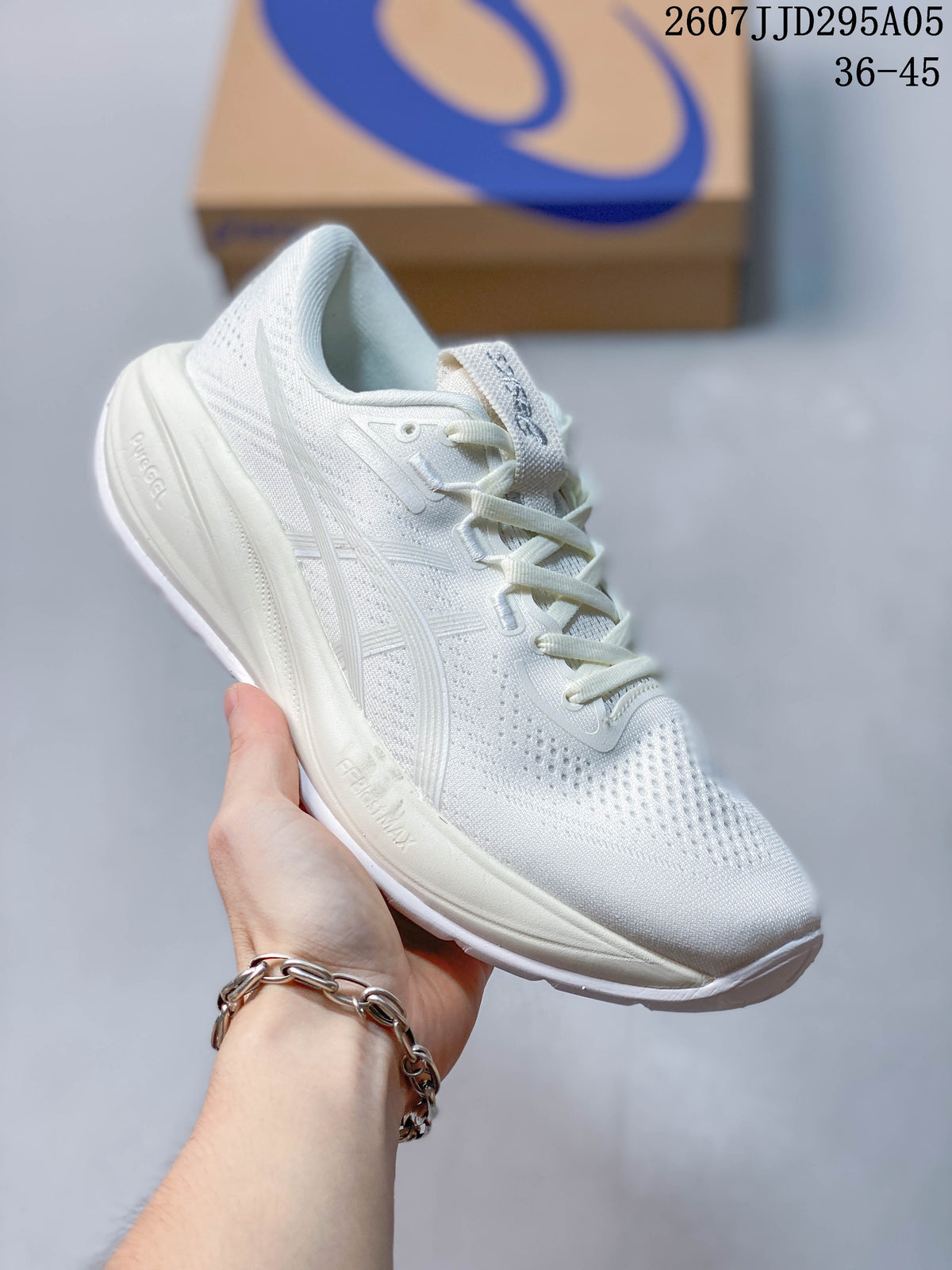 Angled side view of the white ASICS running shoe showing the mesh upper, side branding and thick midsole.