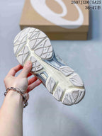 Close-up of the patterned rubber outsole and tread of an ASICS GEL-NYC sneaker.