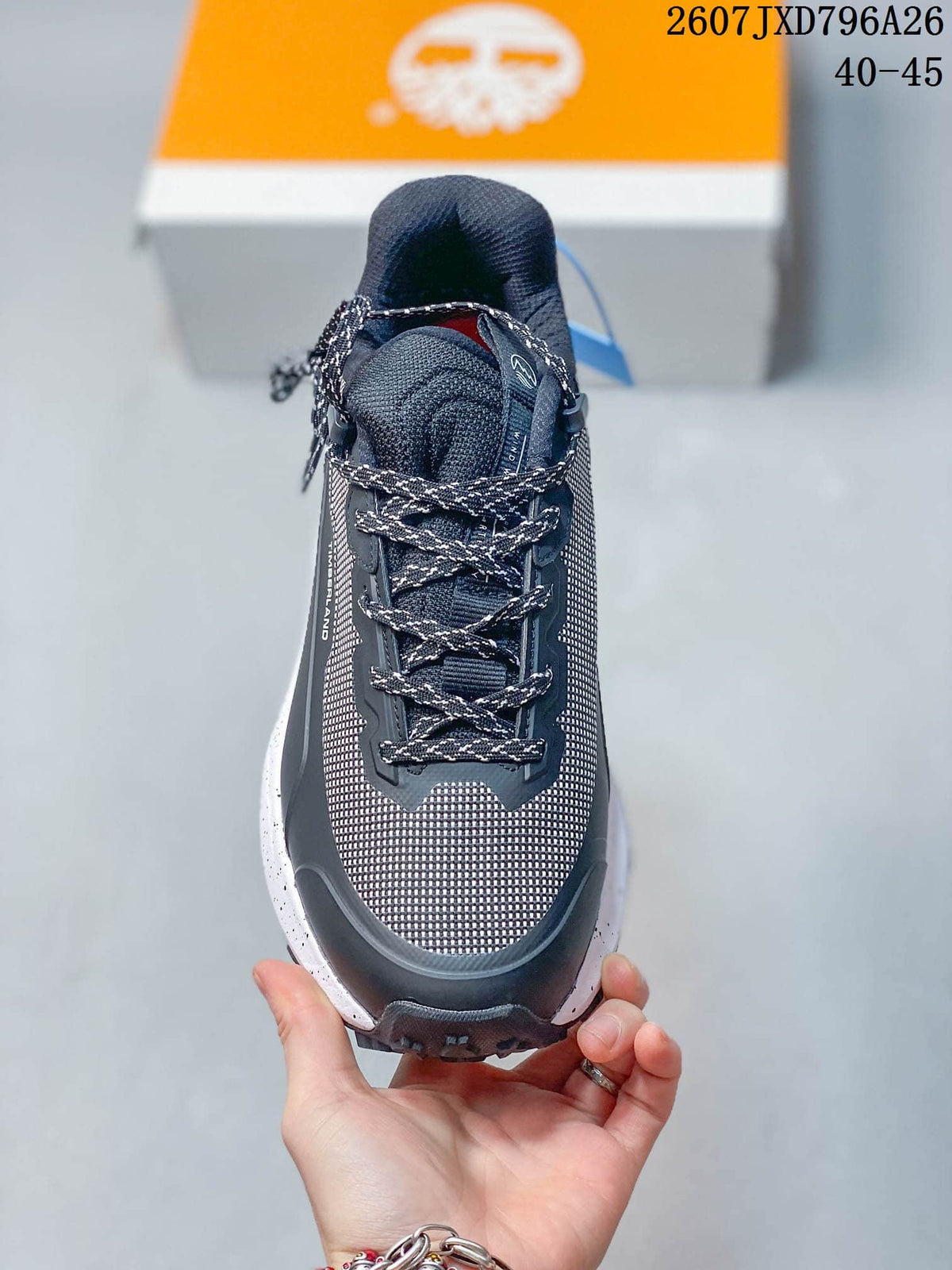 Top view showing the patterned laces, padded tongue, dark collar, and mesh-look toe area.