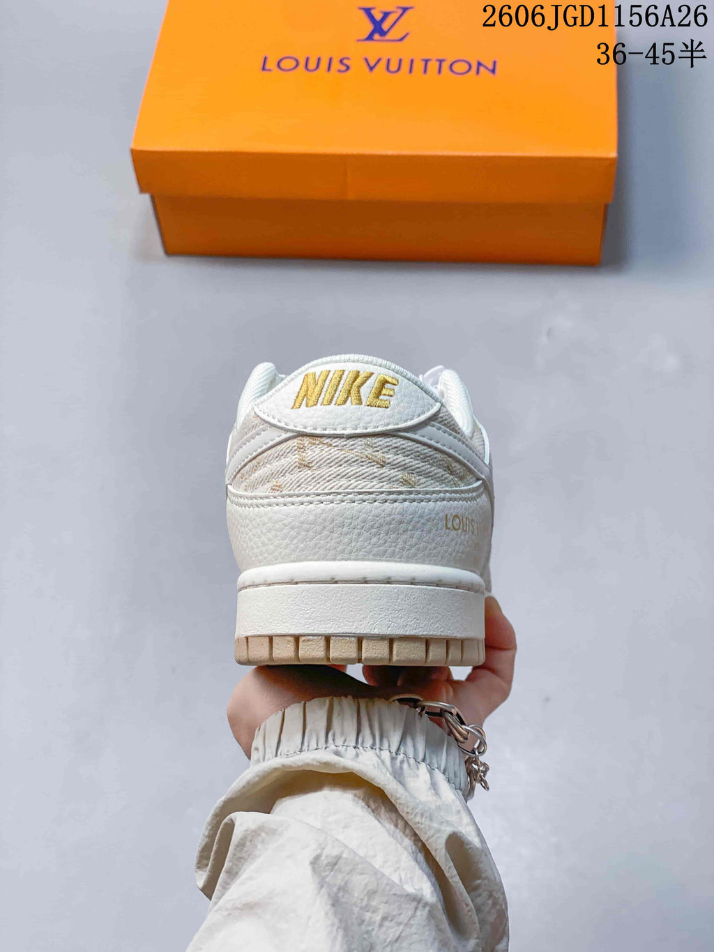 Rear view showing the heel, gold-tone Nike lettering, and tan outsole.