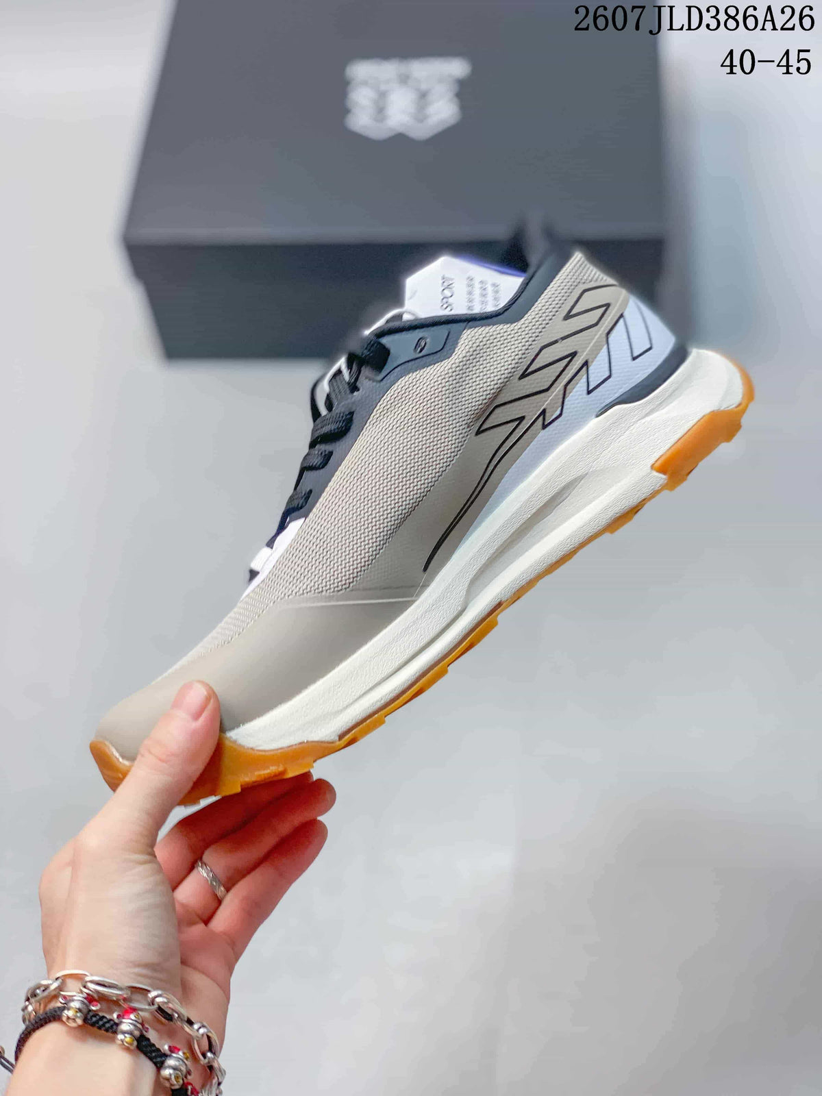 Side view showing the mesh-look upper, layered midsole and angular side detailing.