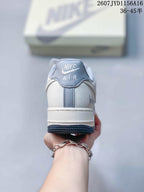 Rear view showing the padded collar, heel branding and layered white and dark outsole.