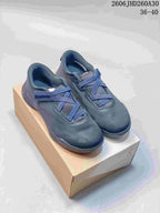 Dark blue On Cloudnova Moon sneakers displayed on a shoebox.