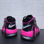 Rear view of black and pink Nike Air More Uptempo sneakers