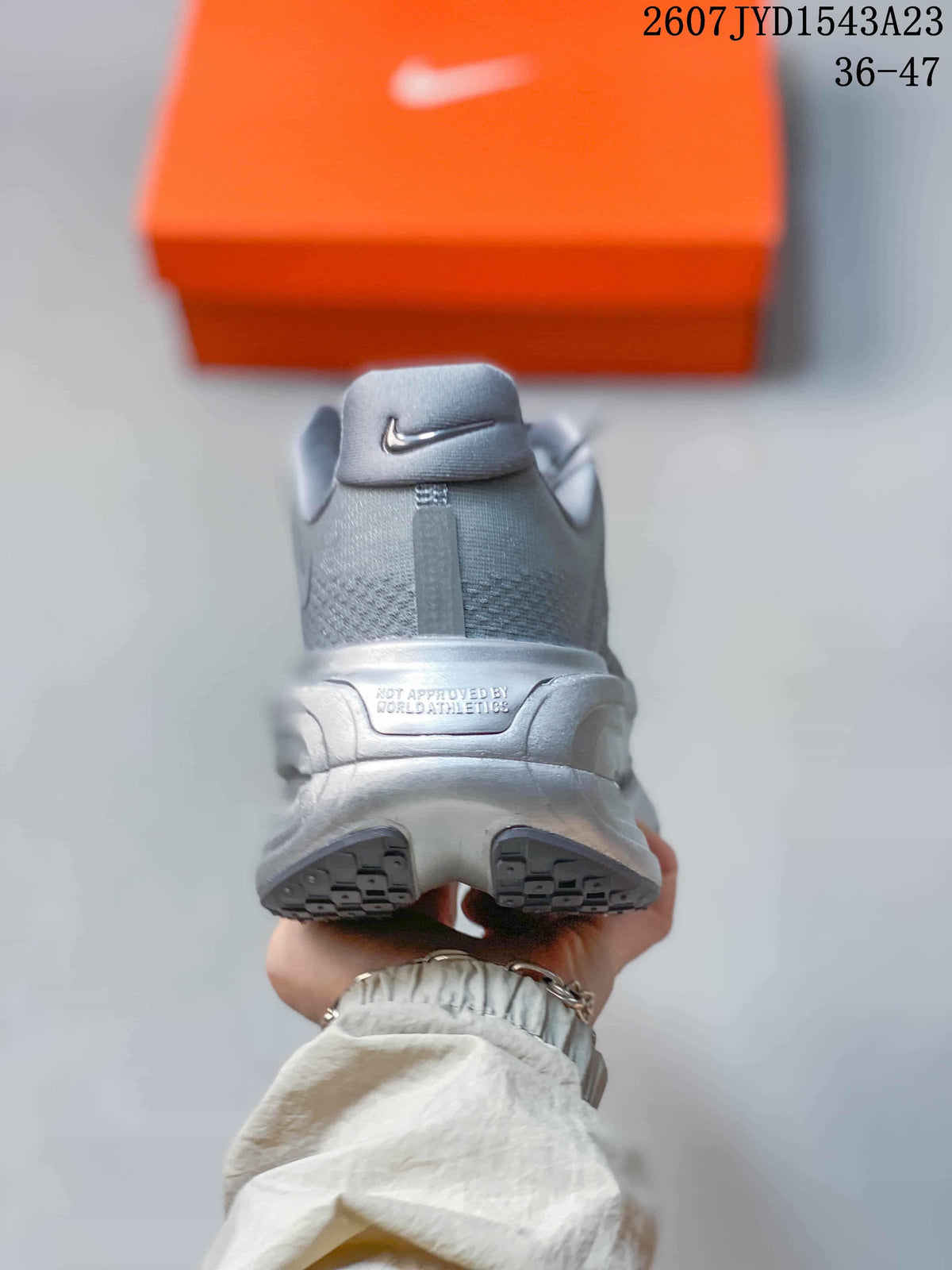 Rear view of the grey Nike Vomero Premium sneaker showing the padded heel and split outsole design.