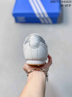 Rear view of the white sneaker showing the heel panel and adidas logo detail.