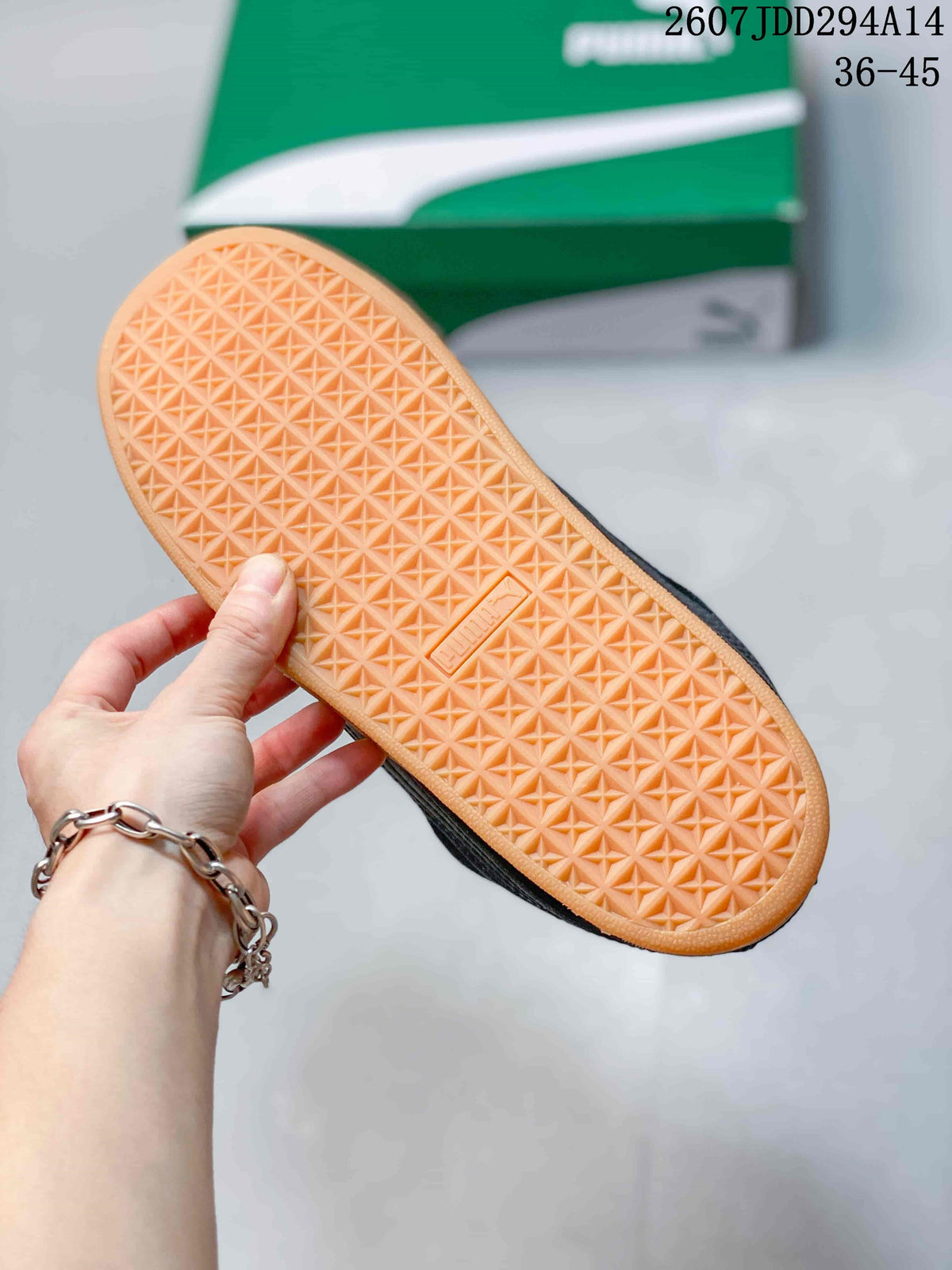 Close-up of the gum-colored outsole showing its repeating textured tread pattern.
