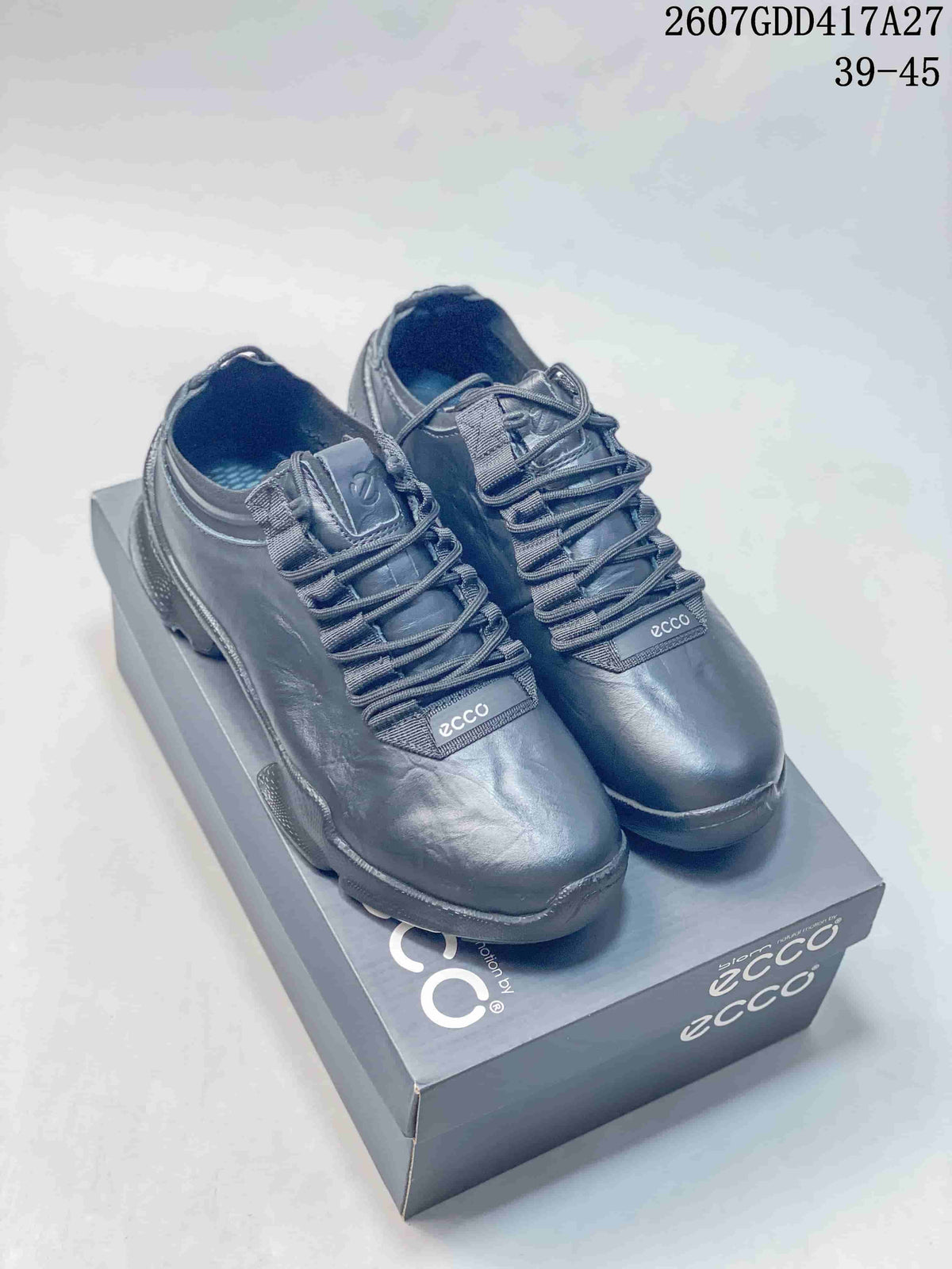 Pair of dark ECCO lace-up sneakers displayed on a branded shoe box; image text shows style code 2607GDD417A27 and size range 39–45.