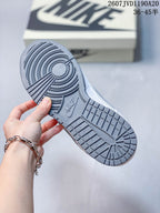 Close view of the grey rubber outsole showing its circular and block-pattern traction.