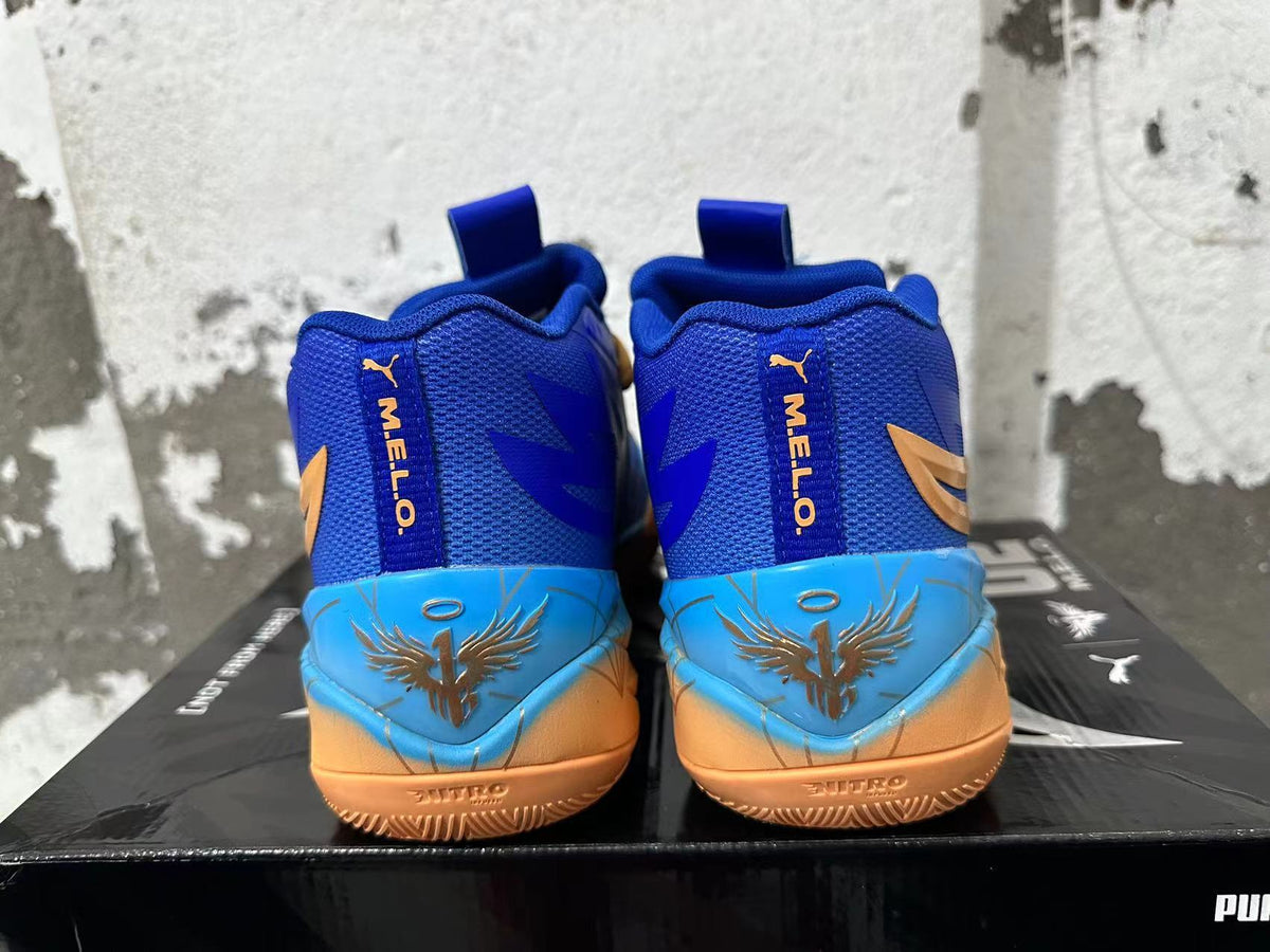 Rear view showing the blue heel, light blue heel panels, and yellow-orange details on Puma Melo shoes.