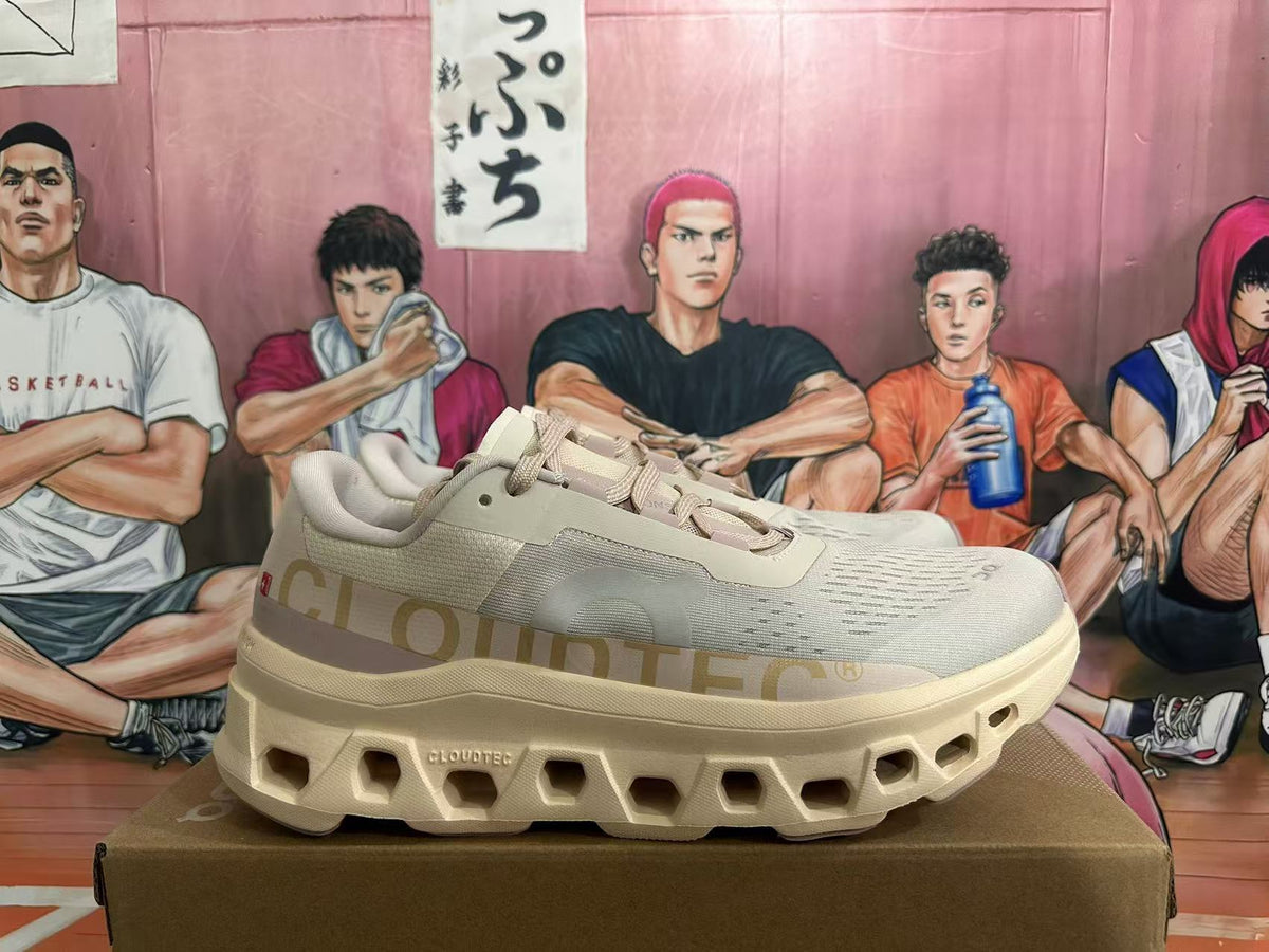 Side view of beige On sneakers with Cloud side lettering and sculpted soles