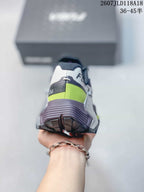 Rear view showing the layered heel structure, lime accent panel and textured outsole.