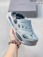 Angled view of the light gray platform clog sandal showing the cutout design and adjustable strap.