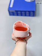 Rear view of the pink sandal showing the raised heel edge and open back.