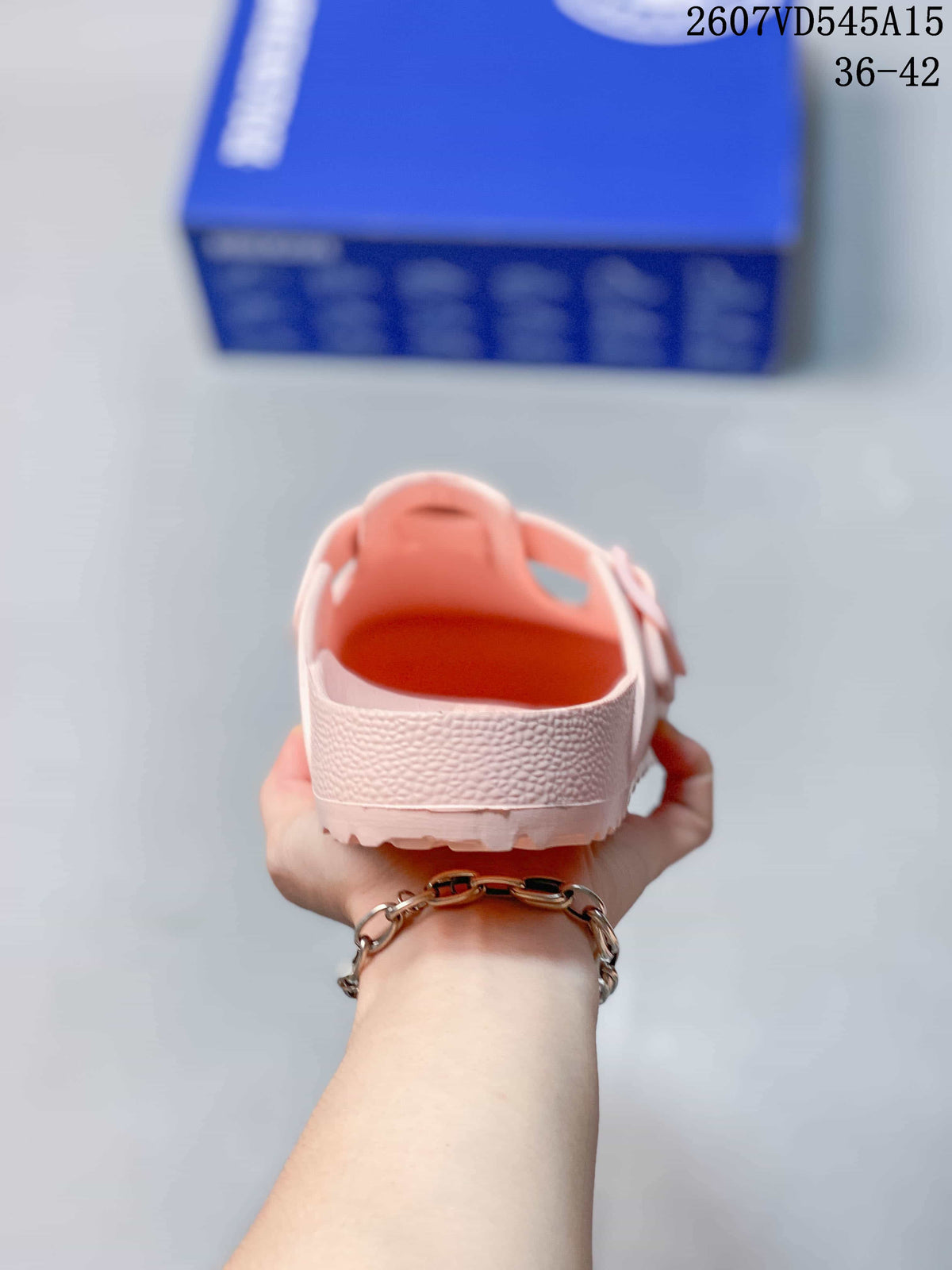 Rear view of the pink sandal showing the raised heel edge and open back.