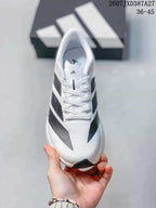 Top view showing the white laces, tongue, toe box, and black patterned side details.