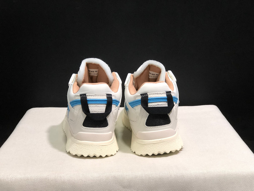 Rear view showing the black heel pull details, blue heel accents, and padded collars.