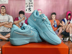 Pair of blue Nike basketball shoes arranged to show their side profiles and mesh uppers.