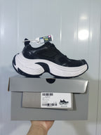 Black and white Skechers sneaker displayed on its box; the box label visibly shows size C 39 and product details.