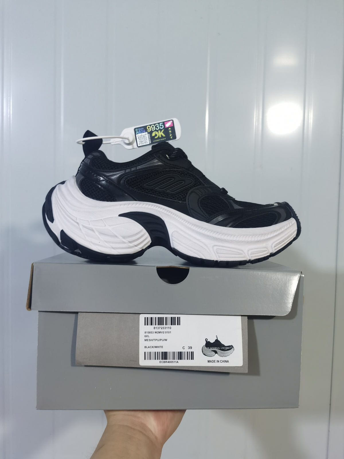 Black and white Skechers sneaker displayed on its box; the box label visibly shows size C 39 and product details.