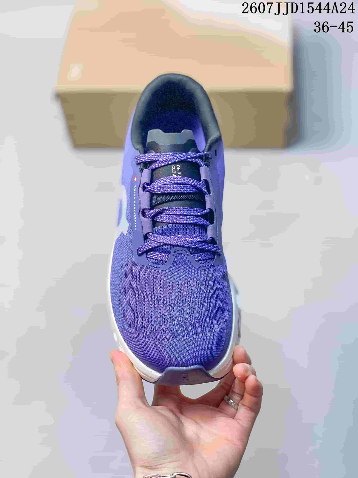 Top view of the purple running shoe showing the lace arrangement, patterned upper, and rounded toe.