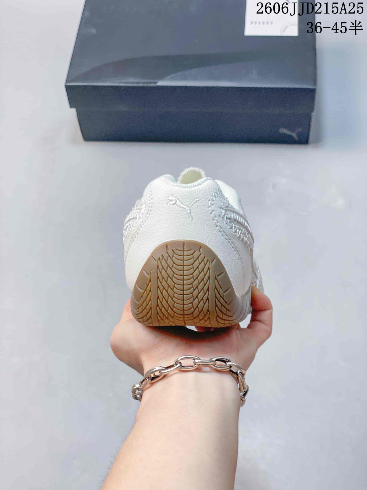 Rear view of an off-white sneaker showing the heel branding and gum-colored outsole wrapping around the heel.