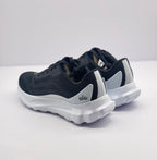 Rear-side view highlighting the black uppers, white heel accents, and outsole edges.