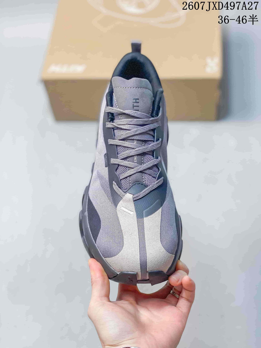 Top view showing the gray lace-up upper, padded tongue and contrasting white front panels.