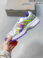 Side profile of the ASICS Gel-Nimbus 16 sneaker showing the lime ASICS stripe, multicolor textile panels, white midsole, and purple outsole.