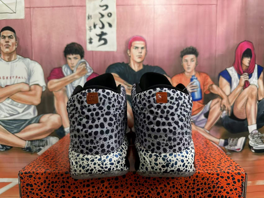 Rear view of black-and-white spotted Nike basketball shoes