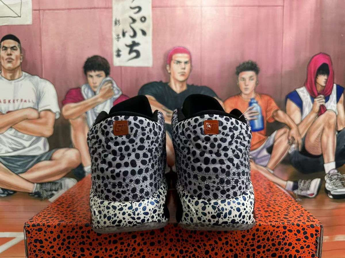 Rear view of black-and-white spotted Nike basketball shoes