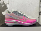 Side view of a Nike GT Cut 3 shoe with pink patterned panels and grey accents