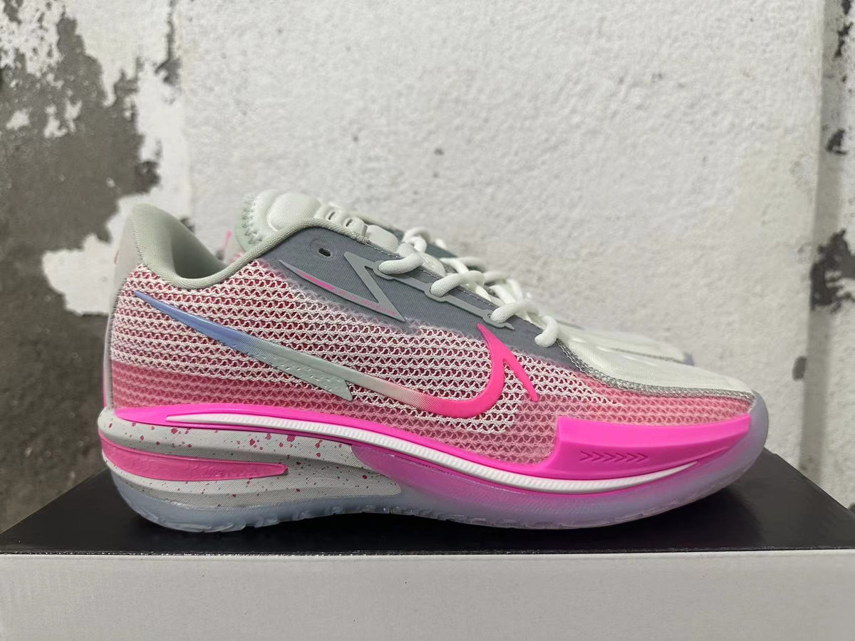 Side view of a Nike GT Cut 3 shoe with pink patterned panels and grey accents
