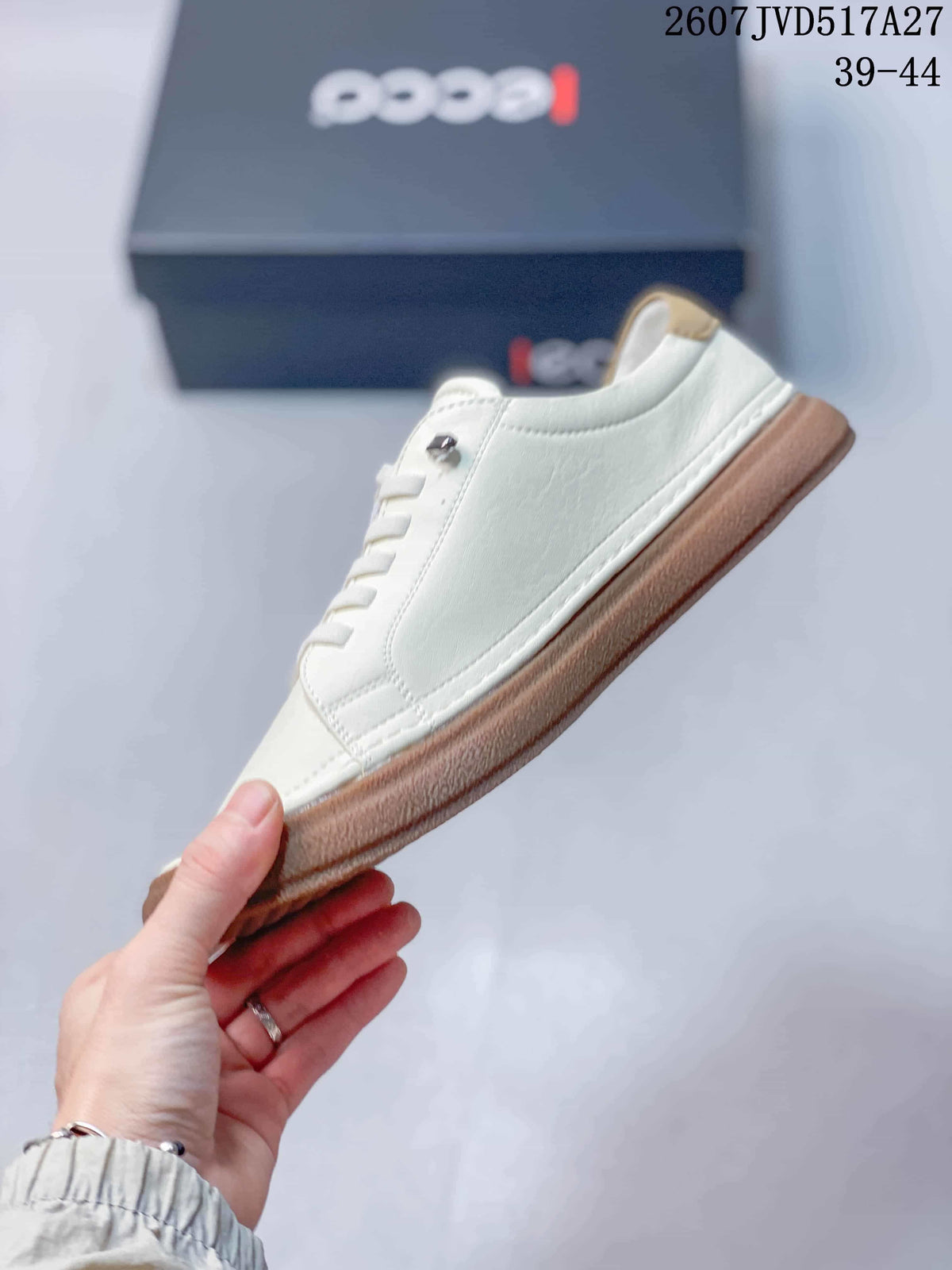 Side profile of the white leather sneaker with tonal stitching and gum-colored sole.