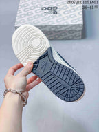 Close-up of the sneaker outsole with off-white and navy tread