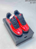 Pair of red and black low-top Nike Air Force 1 sneakers displayed on a black shoebox; image text shows style code 2607TGD230A20 and size range 36–45 with half sizes.