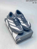 Pair of black and white adidas running sneakers displayed on a shoebox, with the listed range 36–45 and code 2607JXD387A27 visible above.