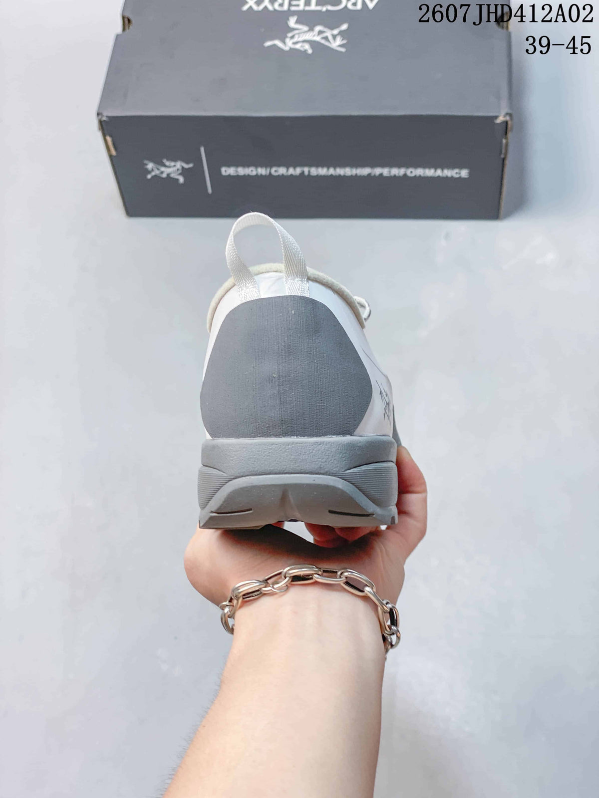 Rear view showing the gray heel panel and pull tab