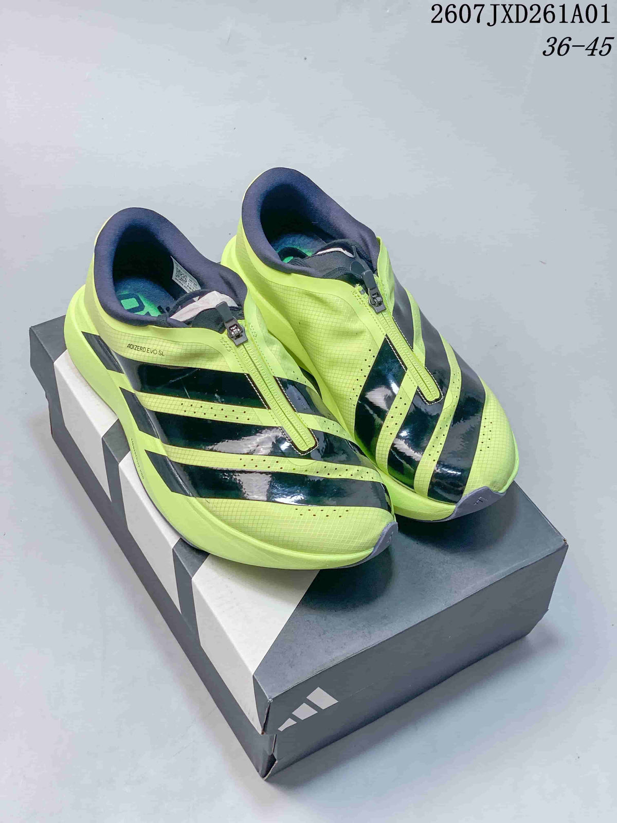 Volt yellow Adidas Adizero Evo SL Zip shoes with dark stripes displayed on a shoe box