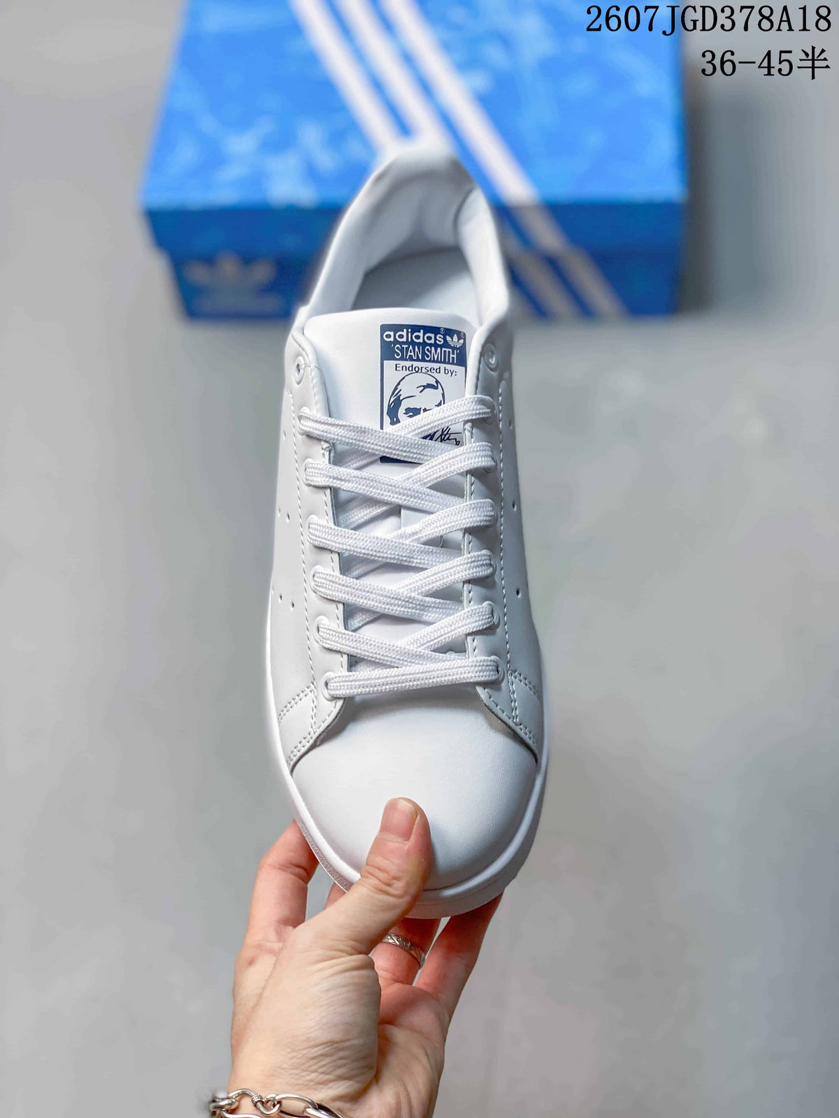 Top view showing the white laces, padded collar, and Stan Smith tongue label.
