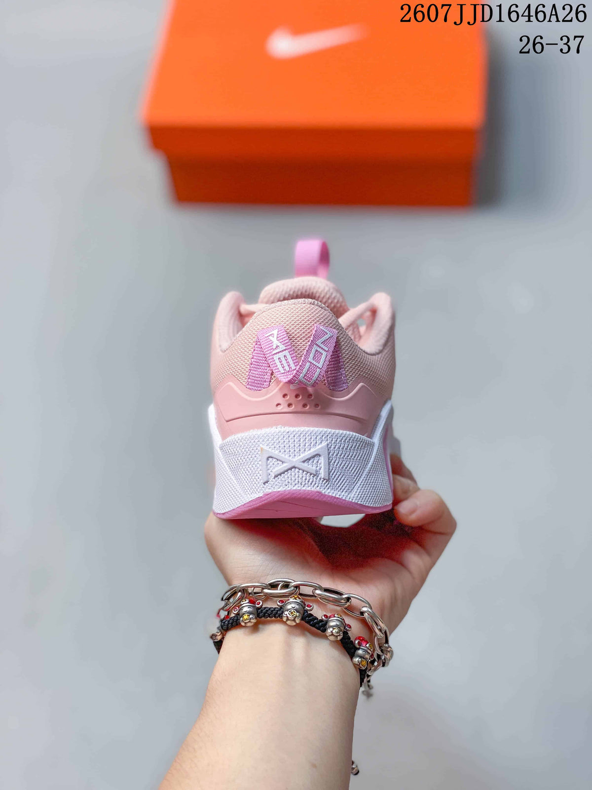 Rear view of the pink and white low-top training shoe showing the heel pull tab and layered heel design.
