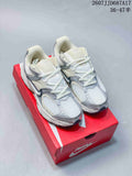 Pair of white and silver Nike V5 RNR sneakers displayed on a red shoebox.