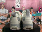 Rear view of beige sneakers with gray heel details and sculpted soles
