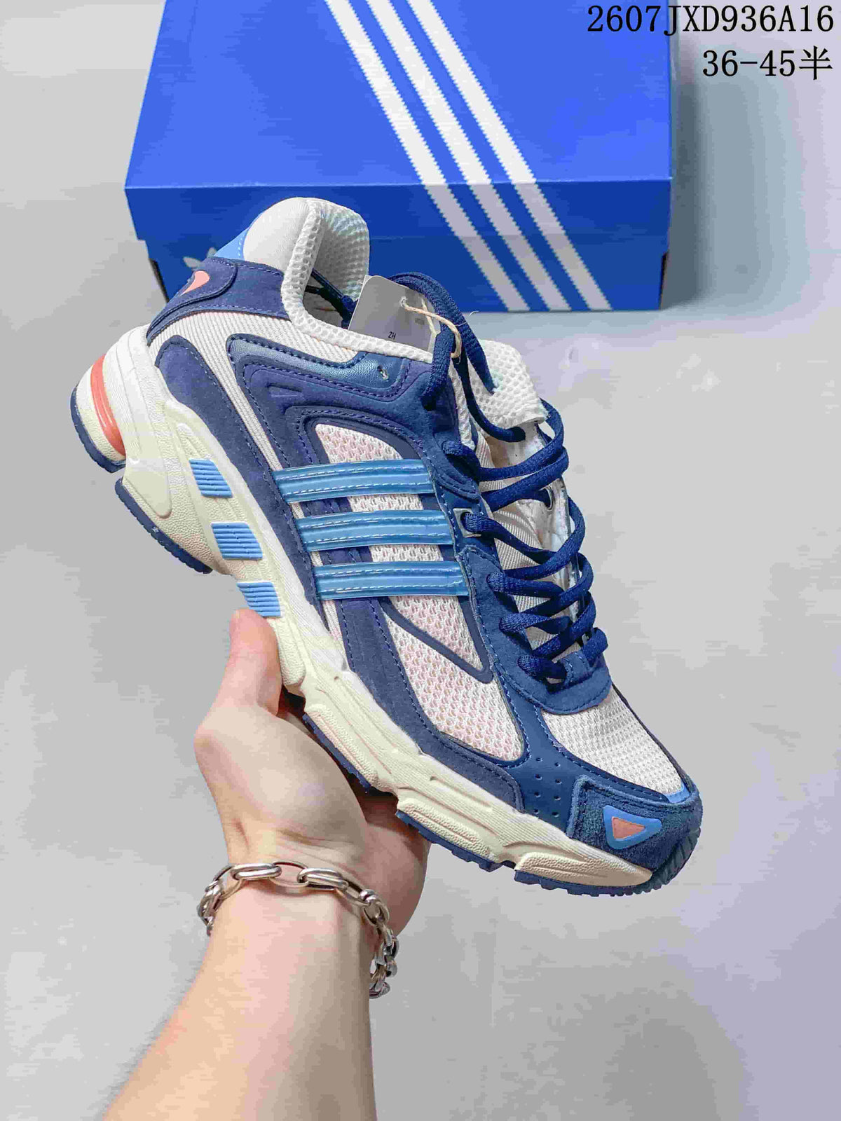 Navy and white adidas Response CL sneaker with light blue side stripes and contrasting outsole details.