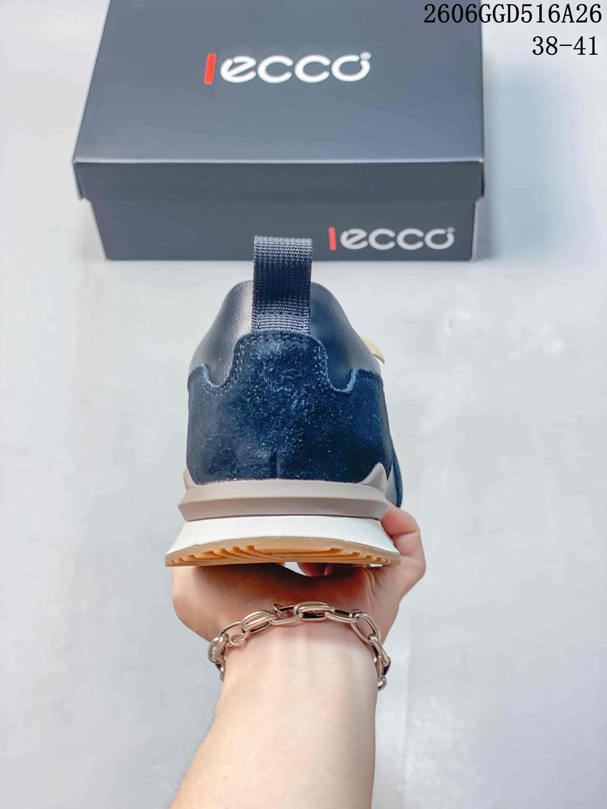 Rear view showing the navy heel panel, pull tab, and layered sole
