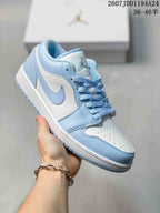 Light blue and white low-top Jordan sneaker shown from a front three-quarter angle, with matching light blue laces and outsole details.